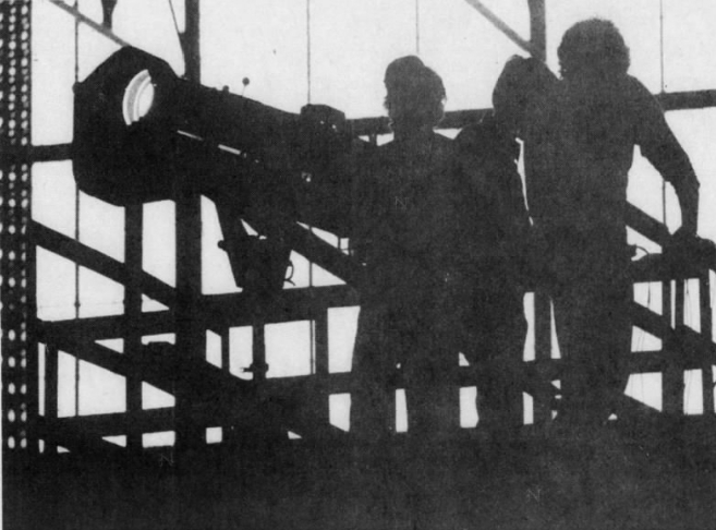 Ithaca Journal (1974.02.23): Spotlight as big as a cannon is tested on its perch high above Barton floor. 