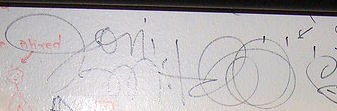 Joni autographed the wall of signatures underneath the coat rack at the<br> Old Town School of Folk Music. 