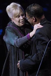 Joni Mitchell greets Herbie Hancock on stage at the gala after being officially inducted into the Canadian Songwriters Hall of Fame. Aaron Harris / CP 
