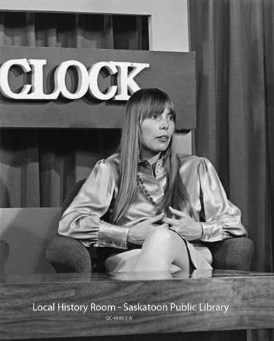 Joni seated on the set of CFQC program<br><i>Top Of The Clock</i>.  Photo by CFQC staff. 