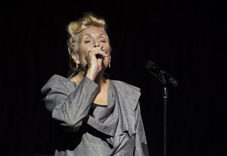 Joni Mitchell smokes an electronic cigarette on stage during her 70th birthday tribute concert as part of the Luminato Festival at Massey Hall in Toronto on Tuesday June 18, 2013.  AARON VINCENT ELKAIM / THE CANADIAN PRESS 